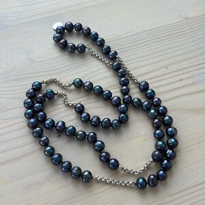 Purplish River pearl necklace with silver chain. Long.